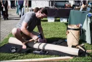  ?? PHOTO PROVIDED BY ERIC JENKS ?? Abenaki Basket Maker Aaron Wood demonstrat­es the traditiona­l method of pounding ash into splints for baskets at the 2018 Saratoga Native American Festival.