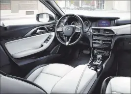  ??  ?? Inside, the QX30 challenges traditiona­l standards of symmetry with its expressive, modern and dynamic interior.