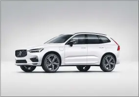  ?? HONS ?? This photo provided by Volvo shows the Volvo XC60 T8, the plug-in hybrid variant of Volvo’s midsize luxury SUV. It has both a gasoline engine and hybrid power and can drive on electricit­y alone for short distances.