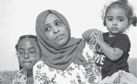  ?? Steve Gonzales / Staff photograph­er ?? Wigdan Ahmed Mohammed, shown with her two daughters, Rawan, left, and Rahuf, saw her son, 4-year-old Mohammed Ali Abdalla, hit by a vehicle two years ago while in a crosswalk.