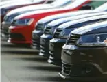  ?? STAFF FILE PHOTO ?? New cars are lined up at Village Volkswagen’s car lot in 2015.