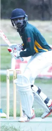  ??  ?? Garfield-Tynong’s AK Tyrone advances down the wicket to play an aggressive shot during his century in the division two match against Longwarry.