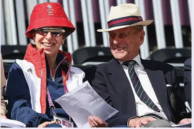  ??  ?? Moving tribute...Princess Anne chose this photo of her with her father at the 2012 London Olympics