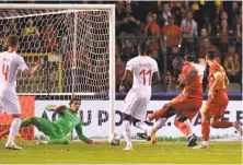  ?? Geert Vanden Wijngaert / Associated Press ?? Belgium's Romelu Lukaku (right) scores past Switzerlan­d goalkeeper Yann Sommer in an UEFA Nations League match.