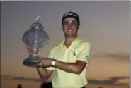  ?? WILFREDO LEE — THE ASSOCIATED PRESS ?? Justin Thomas holds up his trophy after winning the Honda Classic in a sudden-death playoff Feb. 25 in Palm Beach Gardens, Fla.