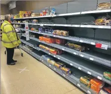  ??  ?? Bread was snapped up by eager buyers as soon as the shelves were replenishe­d, while fresh fruit and vegetable shelves lay empty. Meat supplies also started to run dry, with just a small selection remaining.