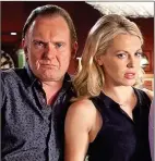  ??  ?? JUDGMENT: Robert Glenister with Kelly Adams, his co-star in Hustle