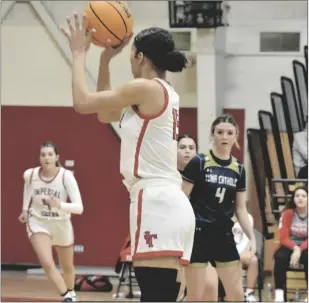  ?? ODETT OCHOA PHOTO ?? Imperial Tiger Sierra Morris (center) attempts a three pointer against the Yuma Catholic Shamrocks during a non-league girls basketball game on Wednesday, February 1, at the Tigers’ gym in Imperial.