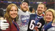  ?? CONTRIBUTE­D ?? Members of the Thuney family — Monica, Joe, Eric and Beth — celebrate on the field after the Patriots beat the Rams in Super Bowl LIII on Sunday in Atlanta. Alter grad Joe earned his second ring in three years.