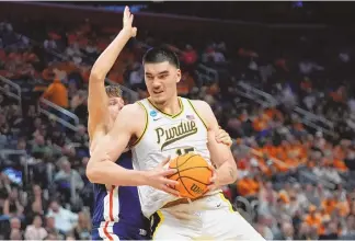  ?? ASSOCIATED PRESS ?? Purdue center Zach Edey is defended by Gonzaga forward Ben Gregg during Friday’s NCAA Tournament Sweet 16 game in Detroit.