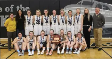  ?? Alex Eller ?? The Mullen girl’s basketball team pose with their third place trophy for Class D2 after defeating Wynot 30-28 on March 5 at Lincoln Northeast High School. Pictured bottom row left to right are: Michelle Brown, Hanna Marshall, Kylie Licking, Samantha Moore, Brooke McCully, Lindey Coble, and Josey French. Top Row: Assistant Coach Trisha Vest, Assistant Coach Kay Dent, Whitney Jennings, Taylor Svoboda, Jordyn McDowell, Shelby Welsh, Alli Loughran, Callie Coble, Faith Miller, Assistant Coach Grayce Ginkens, and Head Coach Clint Svoboda.