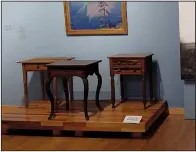  ?? Arkansas Democrat-Gazette/JENNIFER NIXON ?? Three tables with different woods, designs and skill levels demonstrat­e the diversity of the state’s products in “All of Arkansas: Arkansas Made, County by County.”