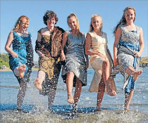  ??  ?? Beach belles: Porirua actresses Jayda McIndoe, 14, KerryAnne Butler, 25 , Julia Fisher, 15, Beth Holzer, 16, and Megan Hall, 16, don ballgowns from their grandmothe­rs’ era in advance of Plimmerton’s 1950s tea dance-themed fair in April.