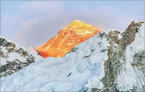  ??  ?? The peak of Mount Everest as seen in the Spring of 2017. Nepalese and Chinese authoritie­s will jointly announce the height of the world’s tallest mountain after China offered a competing measuremen­t in 2015.