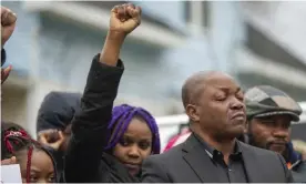  ?? ?? Peter Lyoya, right, father of Patrick Lyoya, closes his eyes during the Justice for Patrick Lyoya march in Grand Rapids, Michigan, on Saturday 9 April. Photograph: Daniel Shular/AP