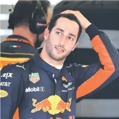  ??  ?? Red Bull’s Australian driver Daniel Ricciardo reacts in the team garage during the Formula One Australian Grand Prix. — AFP photo