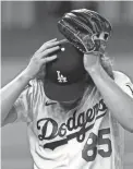  ?? ERIC GAY/AP ?? Dustin May reacts after giving up a home run in the fifth inning of Game 2.