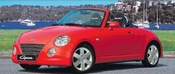  ?? DAIHATSU ?? The 2003 Daihatsu Copen doesn’t have a lot of power under the hood, but at only 810 kilograms, it doesn’t take much to make it fly.