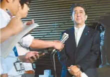  ?? AFP-Yonhap ?? Japan’s Prime Minister Shinzo Abe speaks to reporters at his residence in Tokyo, Tuesday, after North Korea launched a ballistic missile over Japan. Abe said North Korea’s launch of a missile over its territory was an "unpreceden­ted, serious and grave threat.”