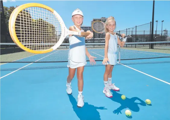  ??  ?? Young tennis players Taylor Burke (left), 11, and Havanna Burke, 9, love the new Queens Park facilities. Picture: Glenn Hampson