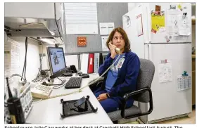  ?? STEPHEN SPILLMAN / FOR AMERICAN-STATESMAN ?? School nurse Julie Carr works at her desk at Crockett High School last August. The Austin district’s 20-page request for nursing and mental health service proposals is crafted to yield a range of possibilit­ies.