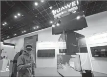  ?? LONG WEI / FOR CHINA DAILY ?? A visitor tries Huawei’s AR glasses during an expo in Hangzhou, Zhejiang province.