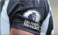  ?? AP FILE PHOTO ?? A detailed view of the “No room for racism” badge is displayed on the shirt of Newcastle United’s Callum Wilson during an English Premier League soccer match earlier this season. English soccer leaders have asked the heads of Facebook and Instagram to show a basic human decency by taking more robust action to eradicate racism and for users identities to be verified.