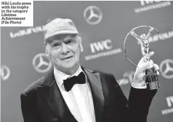  ??  ?? Niki Lauda poses with his trophy in the category Lifetime Achievemen­t (File Photo)