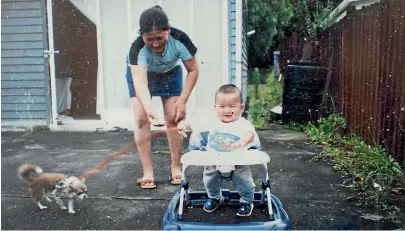  ??  ?? Eason as a baby, with mother Xianglan Hao. She was living here illegally when he was born.