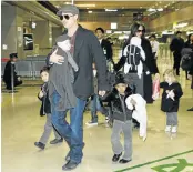  ?? Picture: REUTERS ?? WHO GETS THE KIDS? Pitt and Jolie with their children in 2009. From left, Pax, Knox Leon (carried by Pitt), Maddox (obscured), Zahara, Vivienne (carried by Jolie) and Shiloh