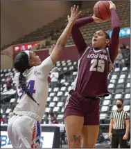  ?? (Photo courtesy UALR Athletics) ?? Alayzha Knapp scored a career-high 18 points to help the University of Arkansas at Little Rock defeat Texas-Arlington 47-40 on Saturday afternoon at the Jack Stephens Center in Little Rock. Knapp was making her second start of the season for the Trojans, who improved to 6-5 overall and 2-2 in the Sun Belt Conference.