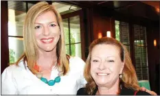  ?? NWA Democrat-Gazette/CARIN SCHOPPMEYE­R ?? Caroline Rochelle, University Women’s Giving Circle executive committee member, (left) and Sandy Steinmetz visit at the April 20 reception.