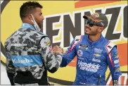  ?? THE ASSOCIATED PRESS FILE ?? Bubba Wallace, left, congratula­tes Kyle Larson after Larson won a NASCAR Cup Series auto race in Las Vegas, in March.