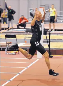  ??  ?? Houston’s Bill Collins sets a world record in the 60-meter hurdles in the men’s 65 age division Saturday at 7.69 seconds.