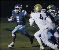  ?? PHOTO BY JIM GENSHEIMER ?? Valley Christian’s Jake Odjegbu (5) runs against Archbishop Mitty in the fourth quarter at Valley Christian March 26 in San Jose. Warriors won 19-10.