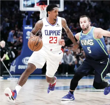  ?? AP FOTO ?? OPENING. Los Angeles Clippers guard Lou Williams looks for an open teammate against Dallas guard J.J. Barea.