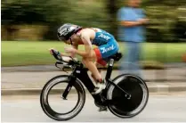  ??  ?? Chad Williamson leaves the first transition at Ross’s Landing during Ironman Chattanoog­a on Sunday.