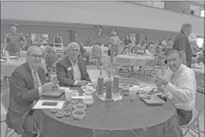  ?? Courier file photo ?? During the 2018 Chili for Children chili cook off, the event’s three judges, Sen. Kim Hammer, left, Commission­er of State Lands Tommy Land and Shane Broadway, vice president of government relations for Arkansas State University, taste the various entries to determine the best chili. This year’s Chili for Children will be from 11 a.m. to 1 p.m. Aug. 6 at the Benton Event Center.