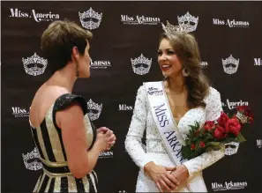  ??  ?? Claudia Raffo of Jonesboro (right), Miss Arkansas 2018, chats with Miss America board of trustees member Jessie Bennett after Raffo’s win in the Miss Arkansas Pageant in June. Raffo will compete for the Miss America crown on ABC tonight.