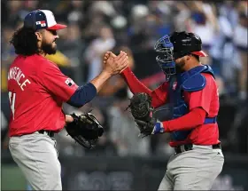  ?? GENE WANG — GETTY IMAGES ?? Team Panama’s Justin Lawrence, left, celebrates with Carlos Sanchez after winning a game in the World Baseball Classic on Wednesday.