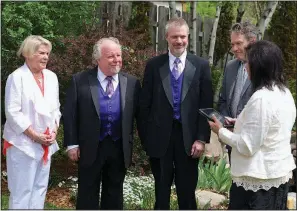  ?? Special to the Democrat-Gazette ?? Jimmy Martin and Drew Jansen were married on May 24, 2014, at their home in Minneapoli­s. Pictured are (left to right) Jimmy’s best woman, Marcia Fluer, Drew’s best man, Peter Staloch, and their officiant, Patty Peterson.