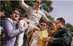  ??  ?? Photo shows dancing American singer Nick Jonas being carried by friends during his wedding celebratio­n at Umaid Bhawan palace in Jodhpur.
