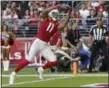  ?? RICK SCUTERI - THE ASSOCIATED PRESS ?? FILE - In this Nov. 18, 2018, Arizona Cardinals wide receiver Larry Fitzgerald (11) pulls in a touchdown catch against the Oakland Raiders during the first half of an NFL football game in Glendale, Ariz.