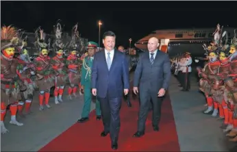  ?? JU PENG / XINHUA ?? President Xi Jinping arrives at Papua New Guinea’s capital Port Moresby on Thursday to pay a state visit to the country and attend the Asia-Pacific Economic Cooperatio­n Economic Leaders’ Meeting.