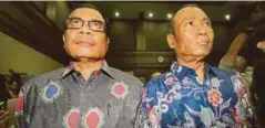  ?? - Agensi ?? IRMAN (kiri) dan Sugiharto ketika hadir ke Mahkamah Rasuah Jakarta bagi mendengar tuduhan rasuah terhadap mereka.