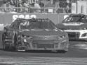  ?? GARY C. KLEIN/USA TODAY NETWORK-WISCONSIN ?? Tyler Reddick leads Chase Elliott through Turn 5 on his way to victory Sunday in the Kwik Trip 250 at Road America, his first win in the NASCAR Cup Series.