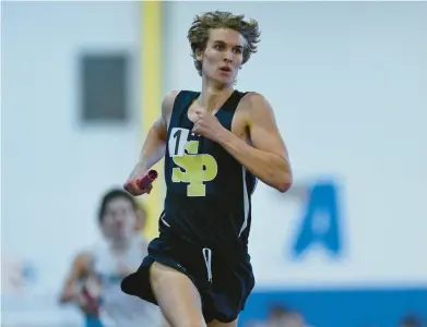  ?? TERRANCE WILLIAMS/FOR CAPITAL GAZETTE ?? Severna Park’s Liam Hagerty runs a leg of the boys Class 4A 4x800-meter relay at the indoor track and field state championsh­ips on Wednesday.