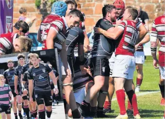  ?? PICS: GEORGE MCMILLAN ?? Feisty affair Tensions rise in front of the TV cameras and left, skipper Blair Macpherson leads out the Bulls