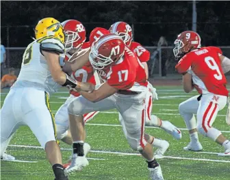  ?? COURTESY PHOTO ?? DOING HIS JOB: North Attleboro tight end Jonathan James (17), son of Patriots vice president of media relations Stacey James, will finish his playing career tomorrow.