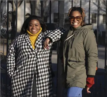  ?? MICHAEL DWYER — ASSOCIATED PRESS ?? Chassity Coston, left, and Charity Wallace meet at Harvard Yard in Cambridge, Mass. They say they're paying closer attention to their menthal health and relying on Black profession­al groups to help them navigate recent tough times.